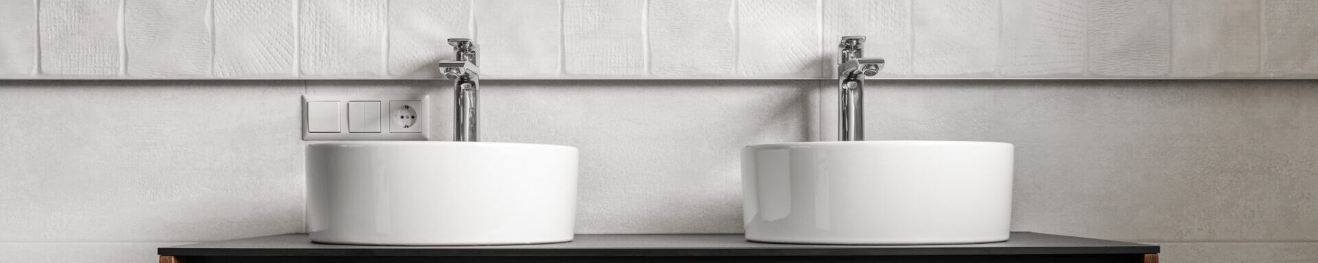 Bathroom Modern Vanity Unit With Two Round Ceramic Sinks, Chrome Faucets And Mirror With Black Frame, White Tales And Wooden Cabinet. Contemporary Bathroom Interior In Minimalist Scandinavian Style